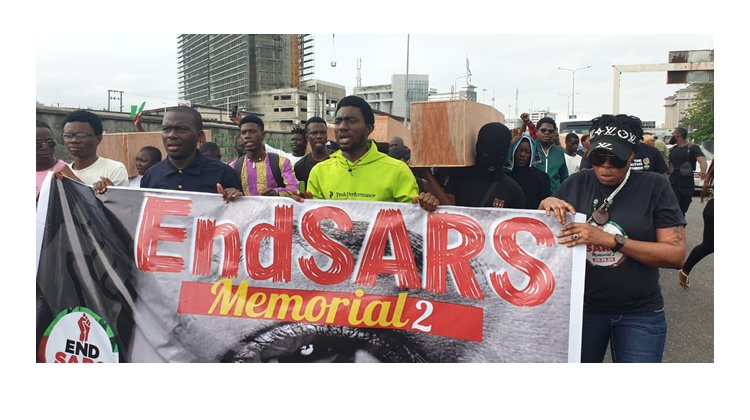 Photo: Dummy coffins, bloodstained flags at #EndSARSmemorial procession